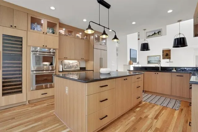 a view of a kitchen with microwave and cabinets