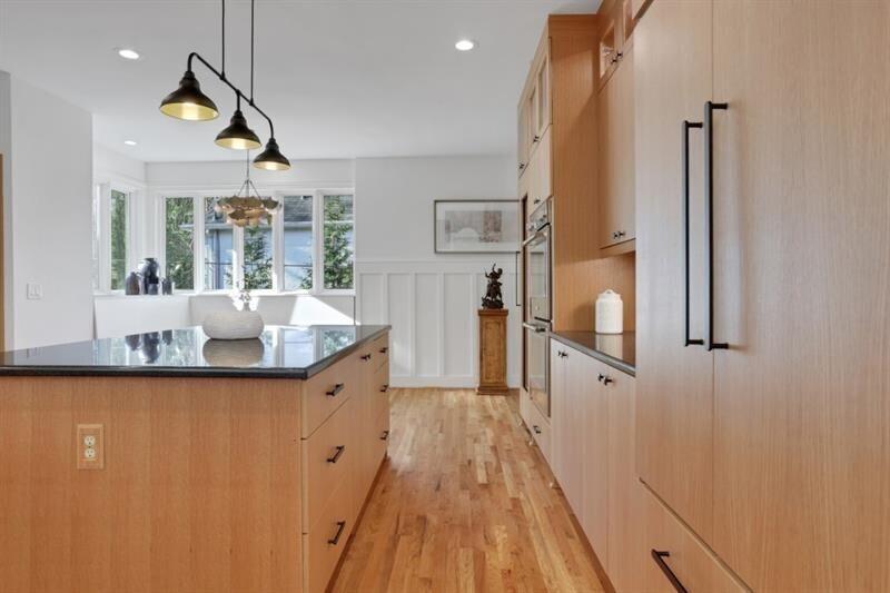 1211 Oakdale Road Northeast Atlanta, GA 30307 - Photo 16 of 67 a kitchen with granite countertop a sink a counter space and stainless steel appliances