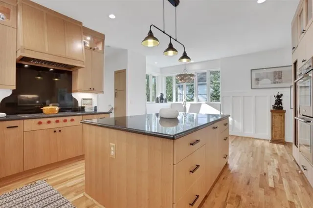 a view of a patio with table and chairs and potted plants