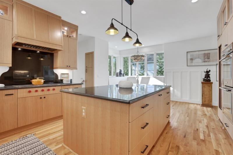 1211 Oakdale Road Northeast Atlanta, GA 30307 - Photo 17 of 67 a large kitchen with stainless steel appliances a large counter top a refrigerator and a sink