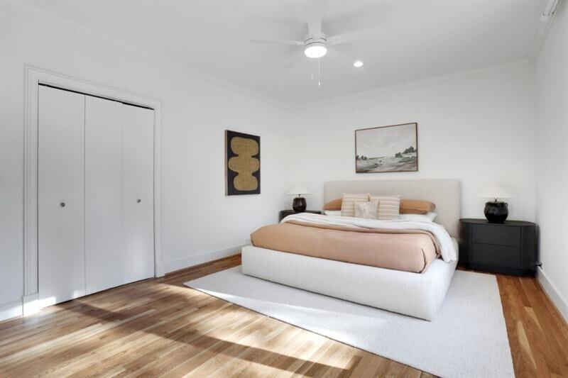 1211 Oakdale Road Northeast Atlanta, GA 30307 - Photo 20 of 67 a bedroom with a bed and a painting on the wall