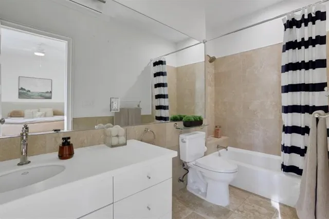 a view of a kitchen with wooden floor and a sink