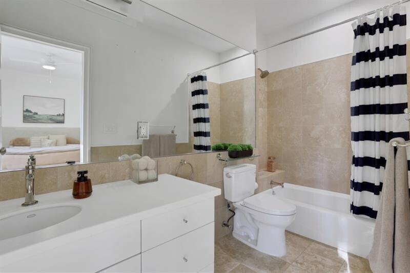 1211 Oakdale Road Northeast Atlanta, GA 30307 - Photo 21 of 67 a bathroom with a sink a toilet and shower