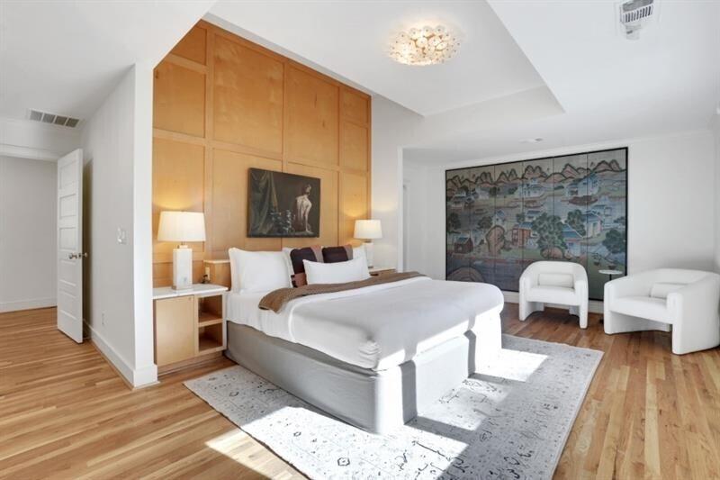 1211 Oakdale Road Northeast Atlanta, GA 30307 - Photo 22 of 67 a bedroom with a bed and wooden floor