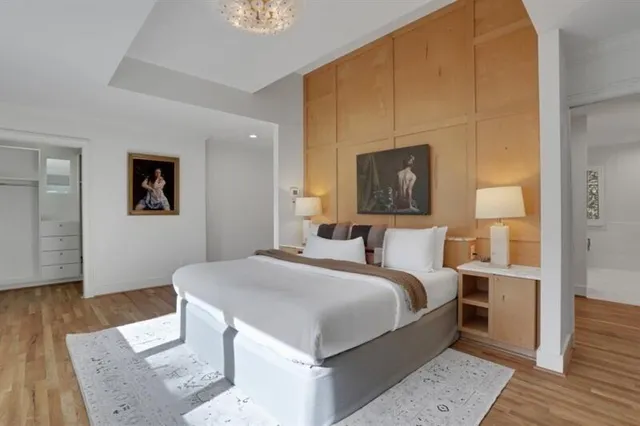 a living room with fireplace furniture and a wooden floor