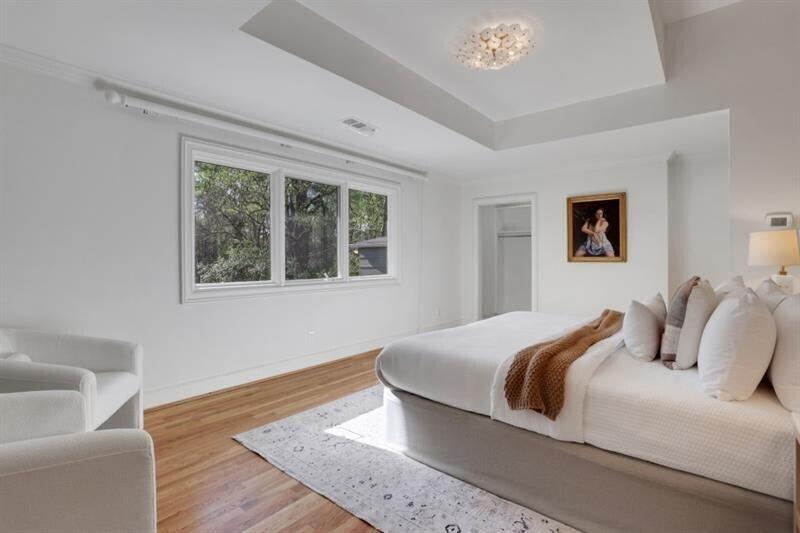 1211 Oakdale Road Northeast Atlanta, GA 30307 - Photo 24 of 67 a bedroom with a large bed and a couch