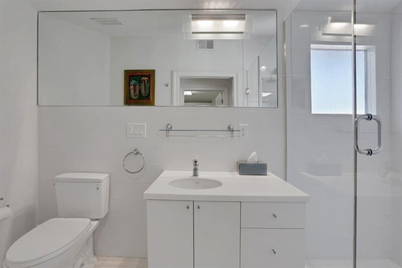 1211 Oakdale Road Northeast Atlanta, GA 30307 - Photo 39 of 67 a bathroom with a toilet sink and mirror
