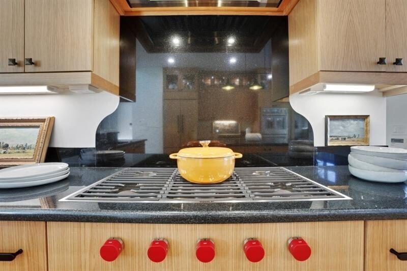1211 Oakdale Road Northeast Atlanta, GA 30307 - Photo 6 of 67 a kitchen with kitchen island granite countertop a sink and white cabinets