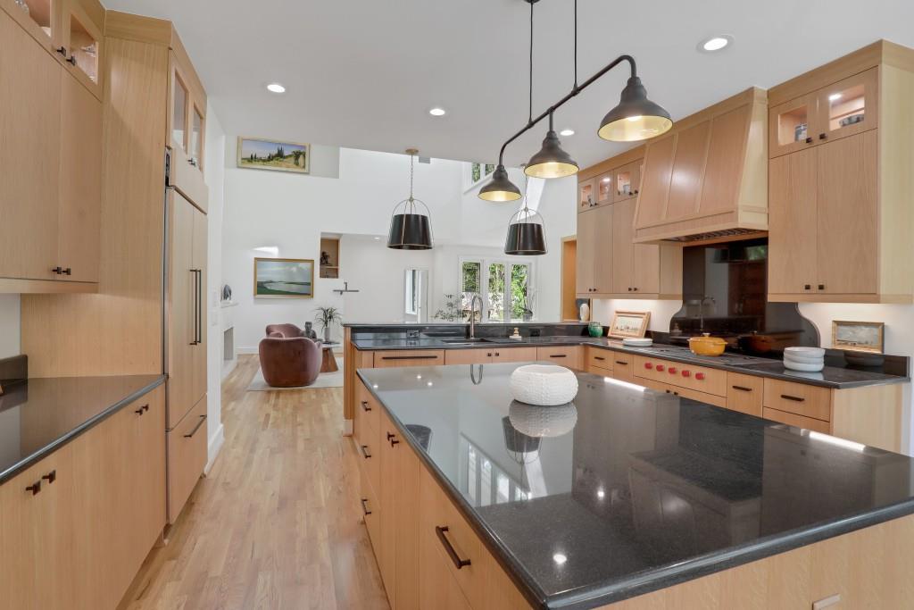 1211 Oakdale Road Northeast Atlanta, GA 30307 - Photo 63 of 67 a kitchen with stainless steel appliances granite countertop a sink a stove and a wooden floors