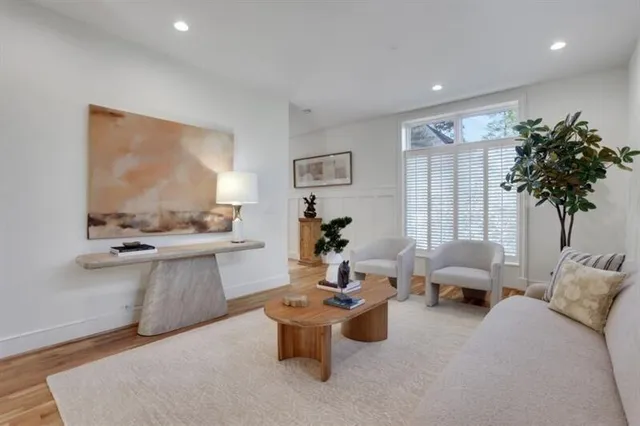 a kitchen with granite countertop a sink a counter space and stainless steel appliances