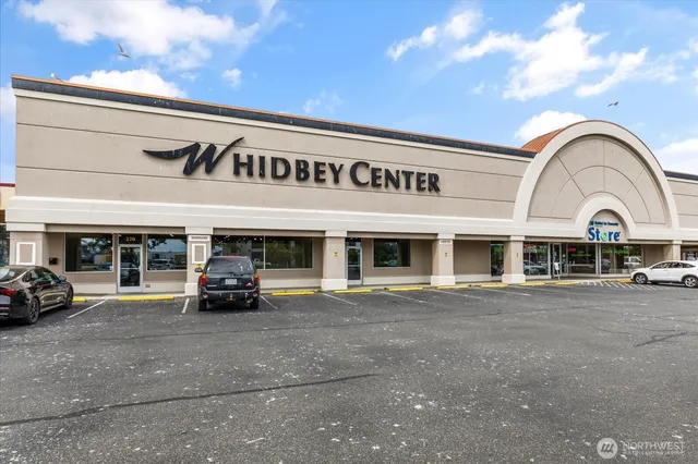 a view of a car parked in front of a building