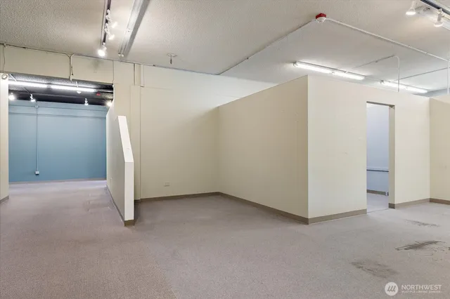 an empty room with a kitchen