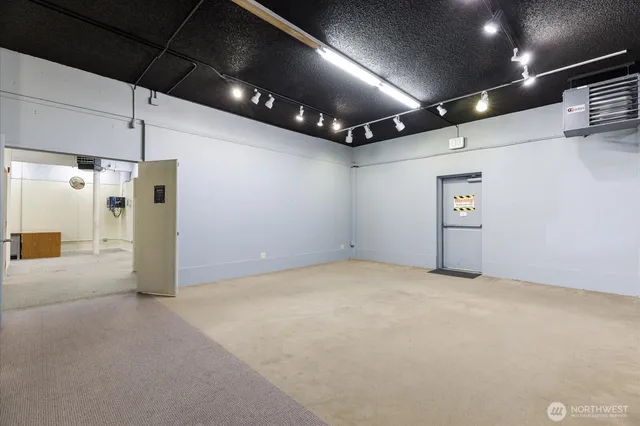 a bathroom with a tub a sink and a mirror