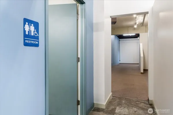 a white toilet sitting next to a bathroom sink