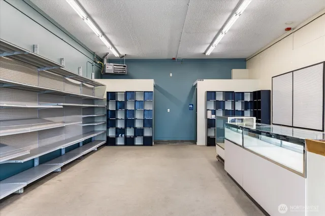 a large white room with closet and mirror