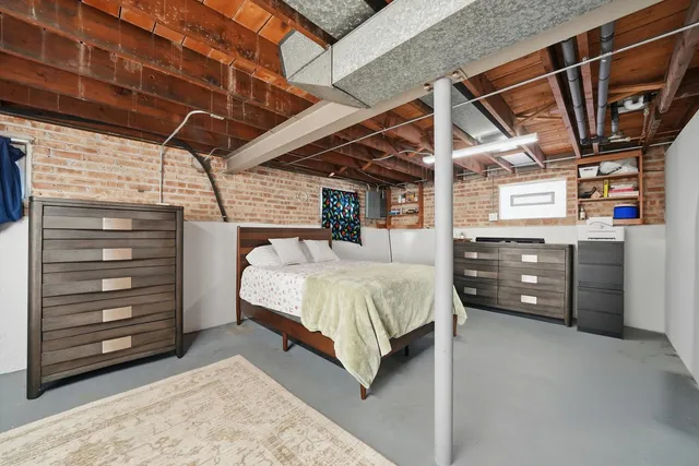 a bed room with a bed and a mirror