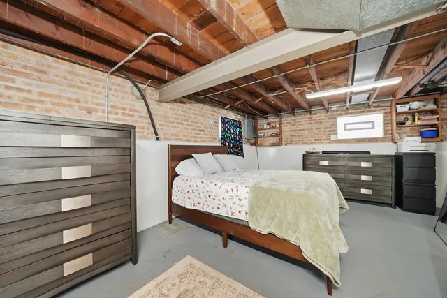 a bed room with bed and window