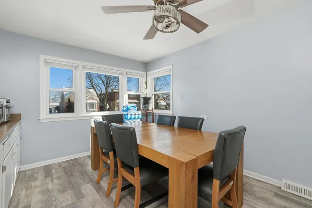 a view of a dining room with furniture and window