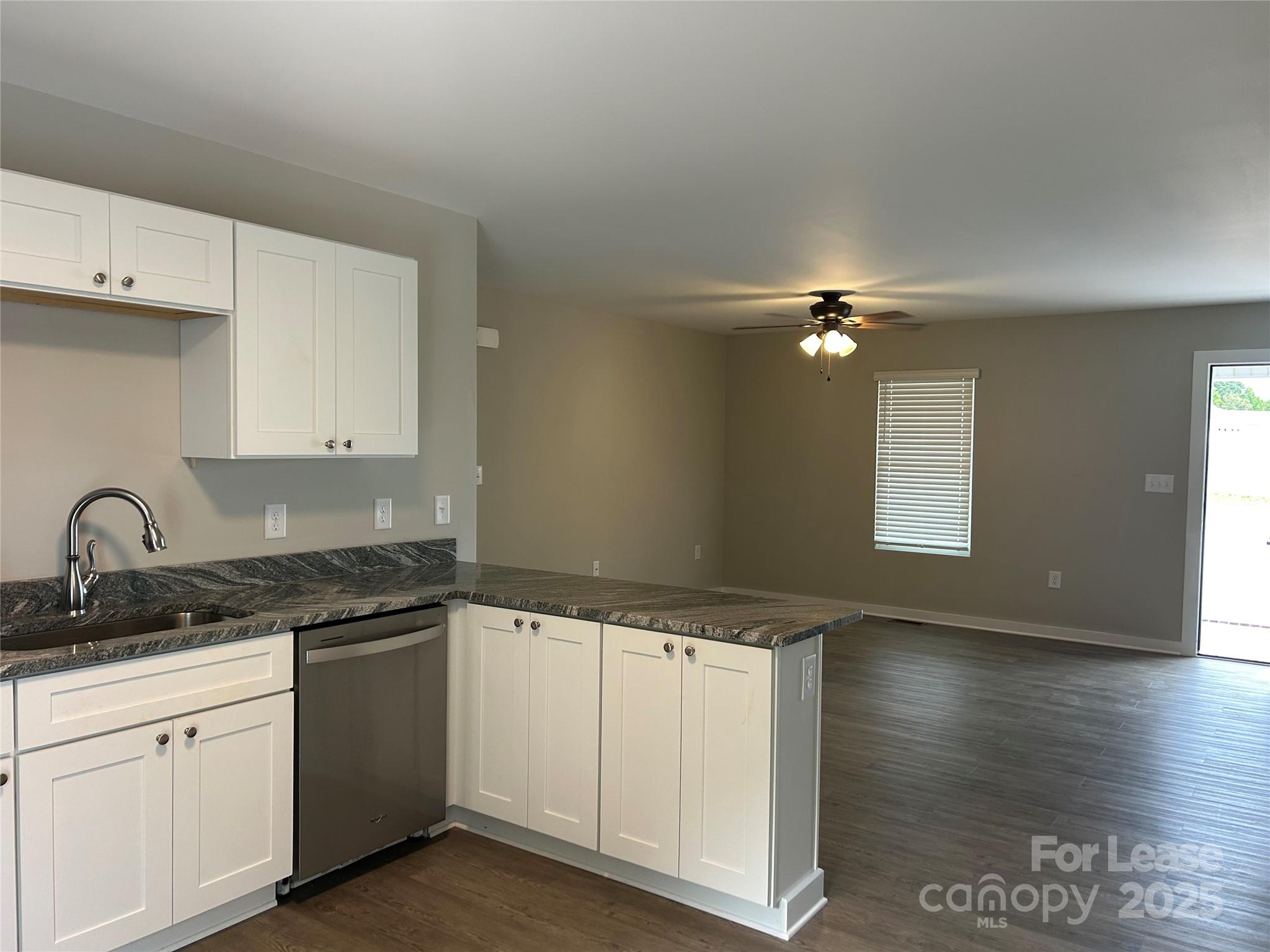 3299 Paul Elmore Road Lincolnton, NC 28092 - Photo 3 of 14 a kitchen that has a sink and cabinets