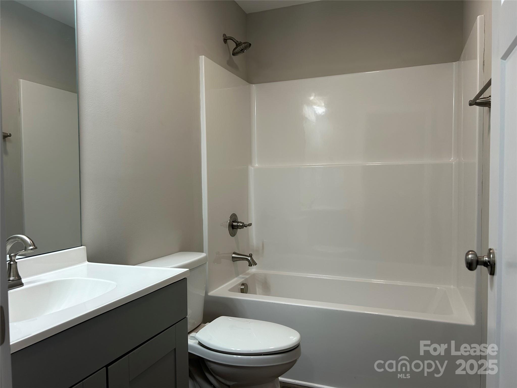 3299 Paul Elmore Road Lincolnton, NC 28092 - Photo 6 of 14 a bathroom with a bathtub shower sink vanity mirror and toilet