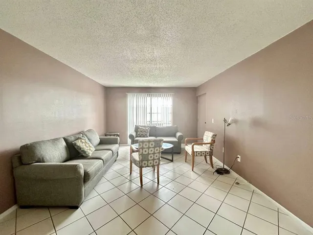 a living room with furniture and window