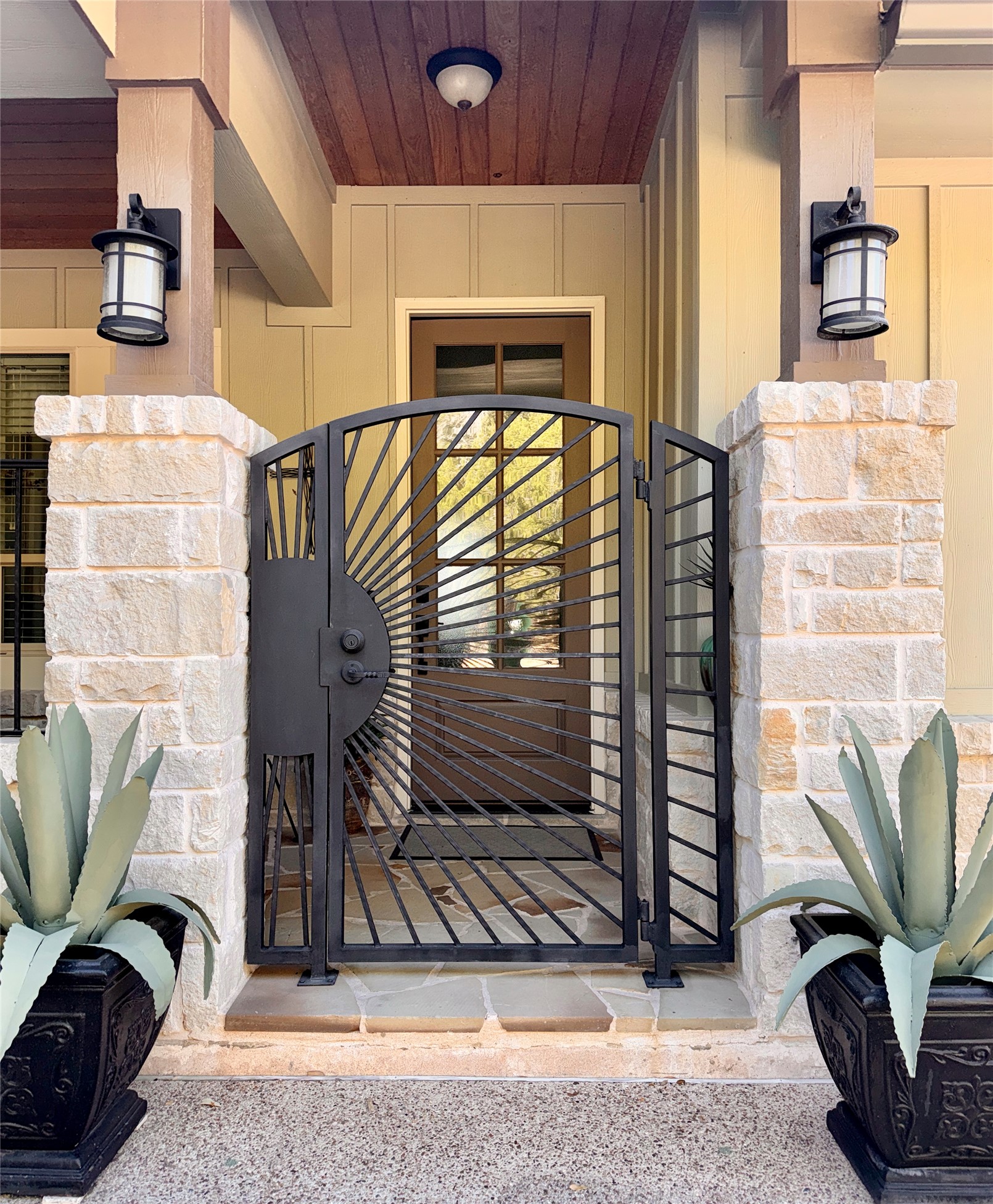 261 Barber Drive Wimberley, TX 78676 - Photo 2 of 37 Property entrance with a gate and stone siding