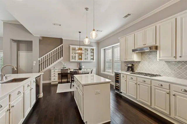 a view of a dining room with furniture wooden floor and chandelier