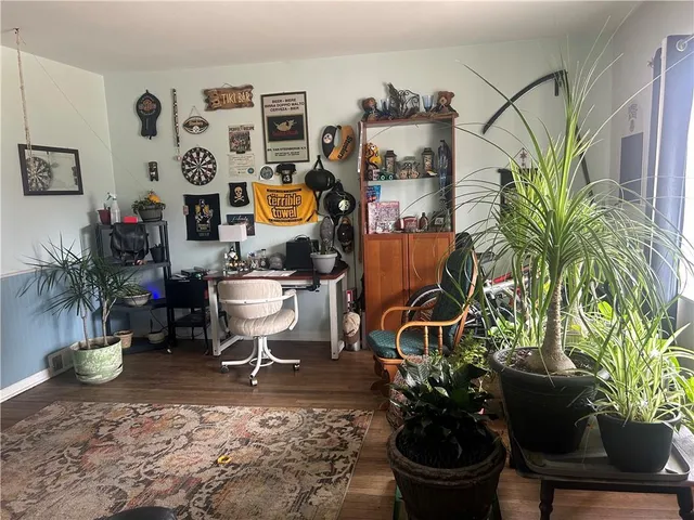 a bedroom with furniture and a fireplace
