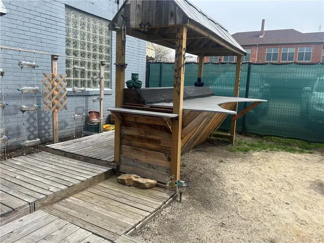 a bed room with a bed furniture and a wooden floor