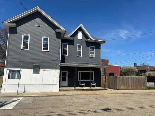 a front view of a house with a garage