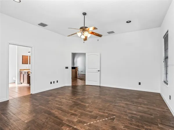 a bathroom with a sink vanity and mirror