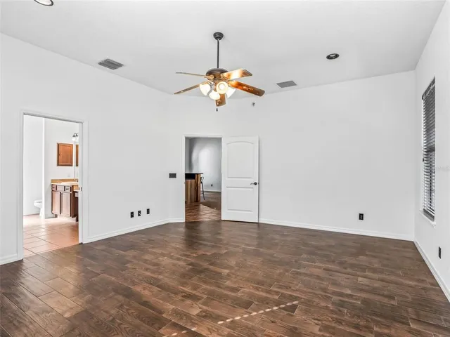 a bathroom with a sink vanity and mirror