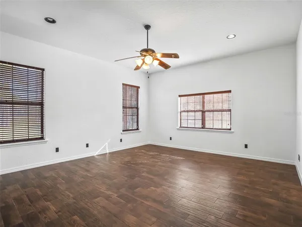 a bathroom with a tub shower and sink