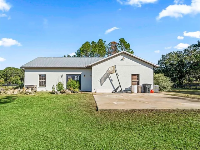 a aerial view of a house with a yard