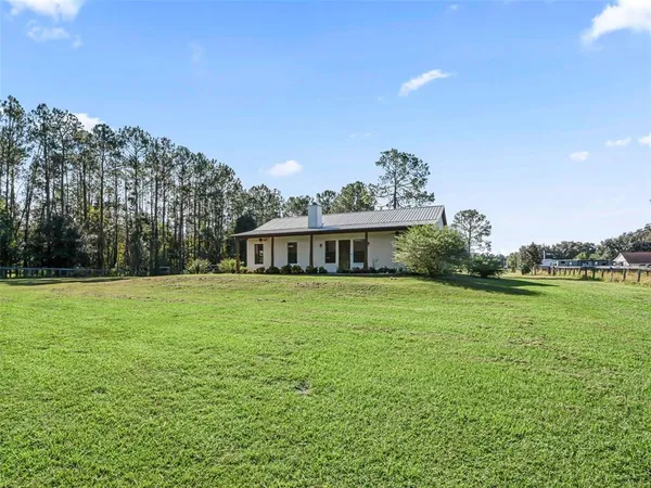 a view of a house with a big yard