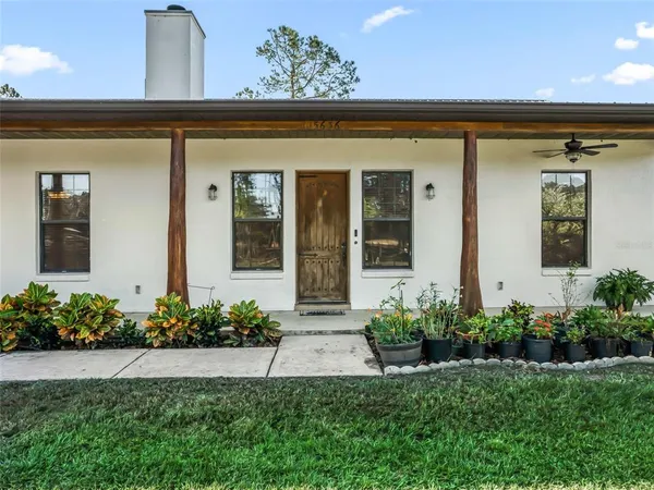 a front view of a house with a porch