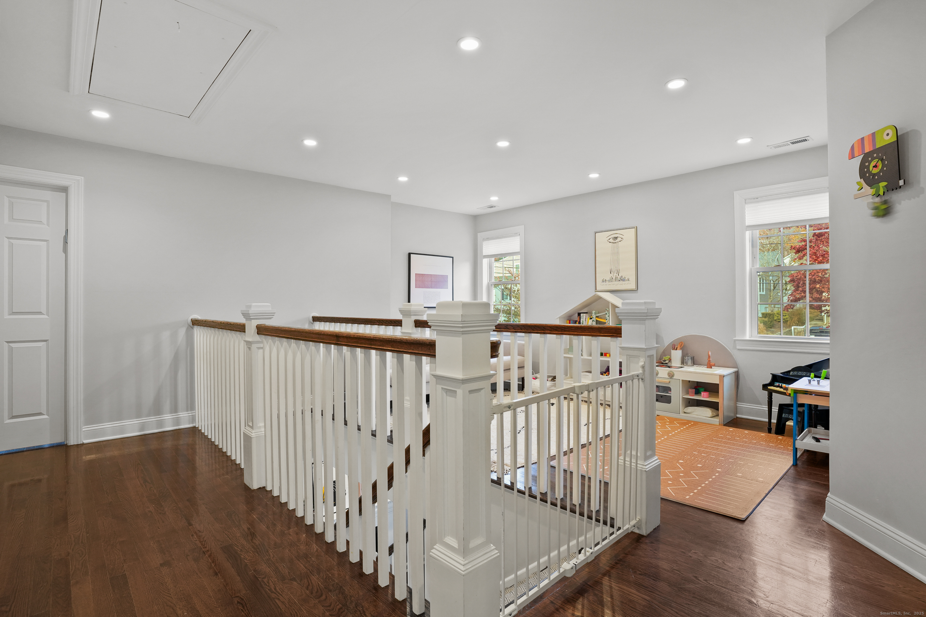100 Hirsch Road Stamford, CT 06905 - Photo 14 of 39 a view of a hallway with wooden floor and windows