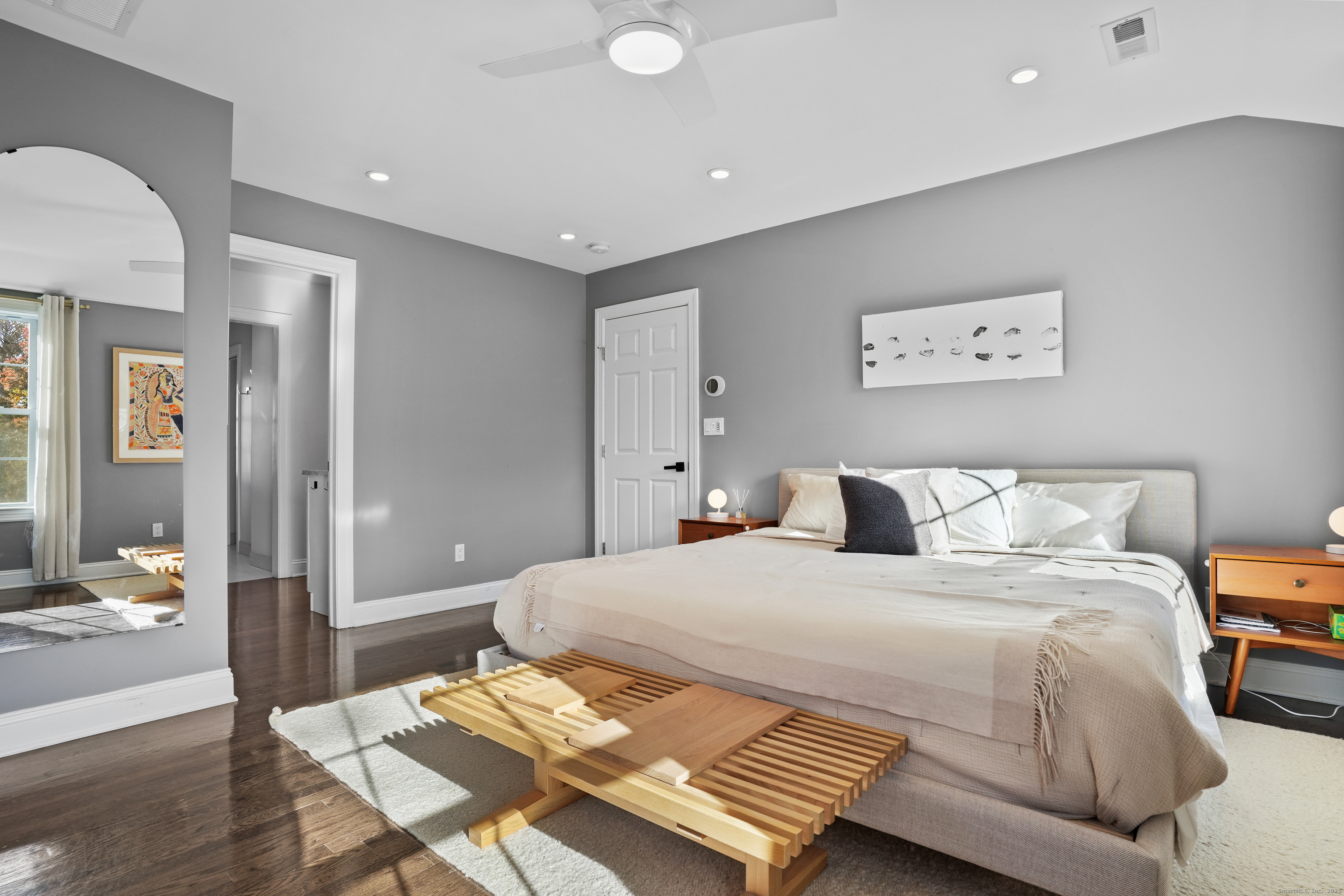 100 Hirsch Road Stamford, CT 06905 - Photo 17 of 39 a bedroom with a bed and wooden floor