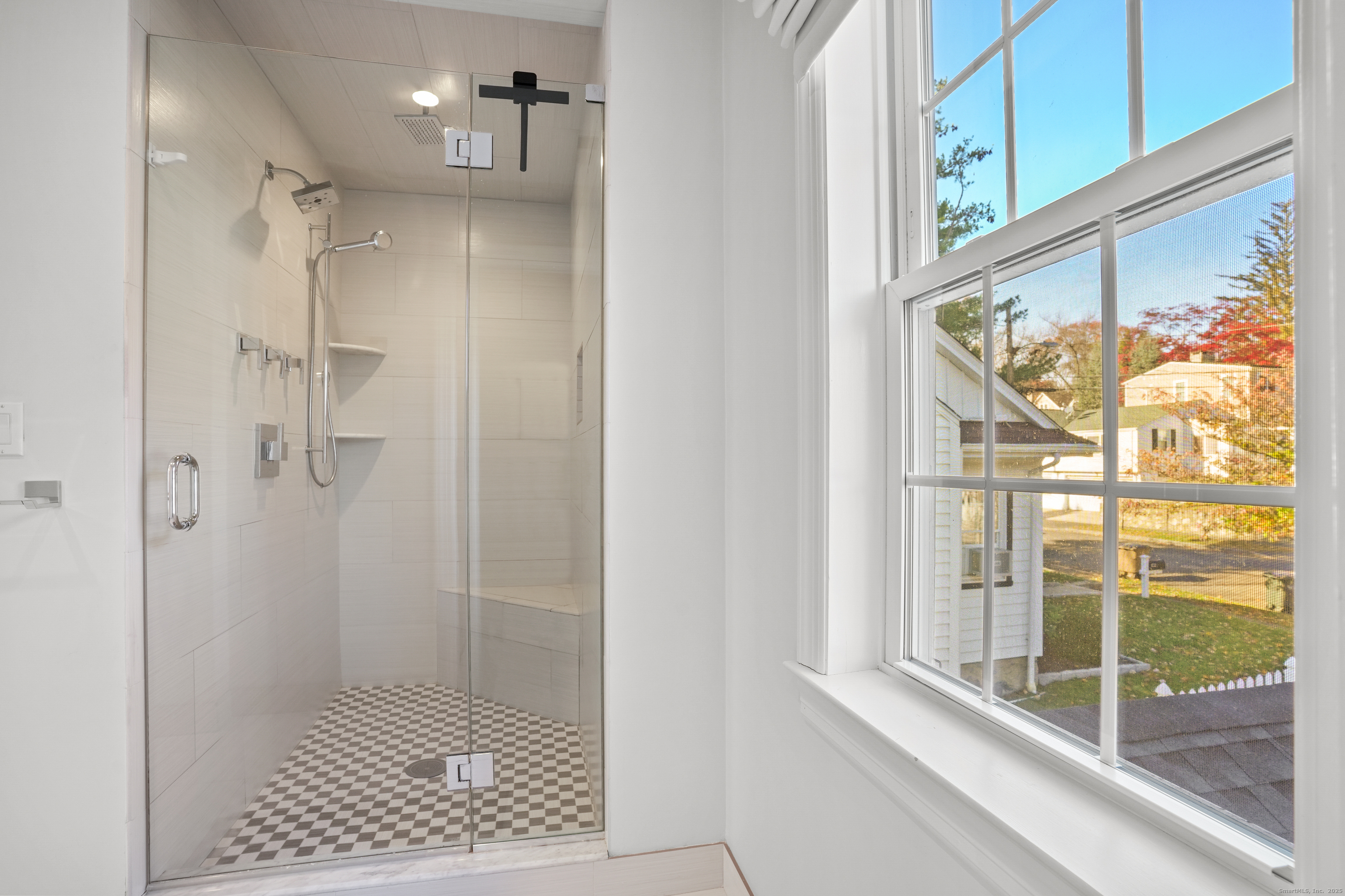 100 Hirsch Road Stamford, CT 06905 - Photo 23 of 39 a bathroom with a glass shower door