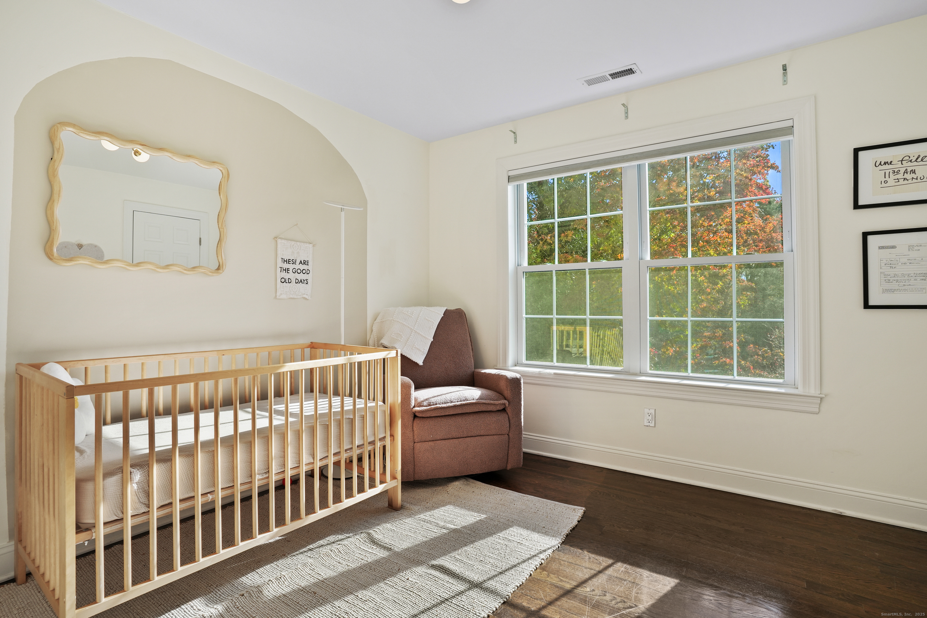 100 Hirsch Road Stamford, CT 06905 - Photo 27 of 39 a bedroom with a bed and wooden floor