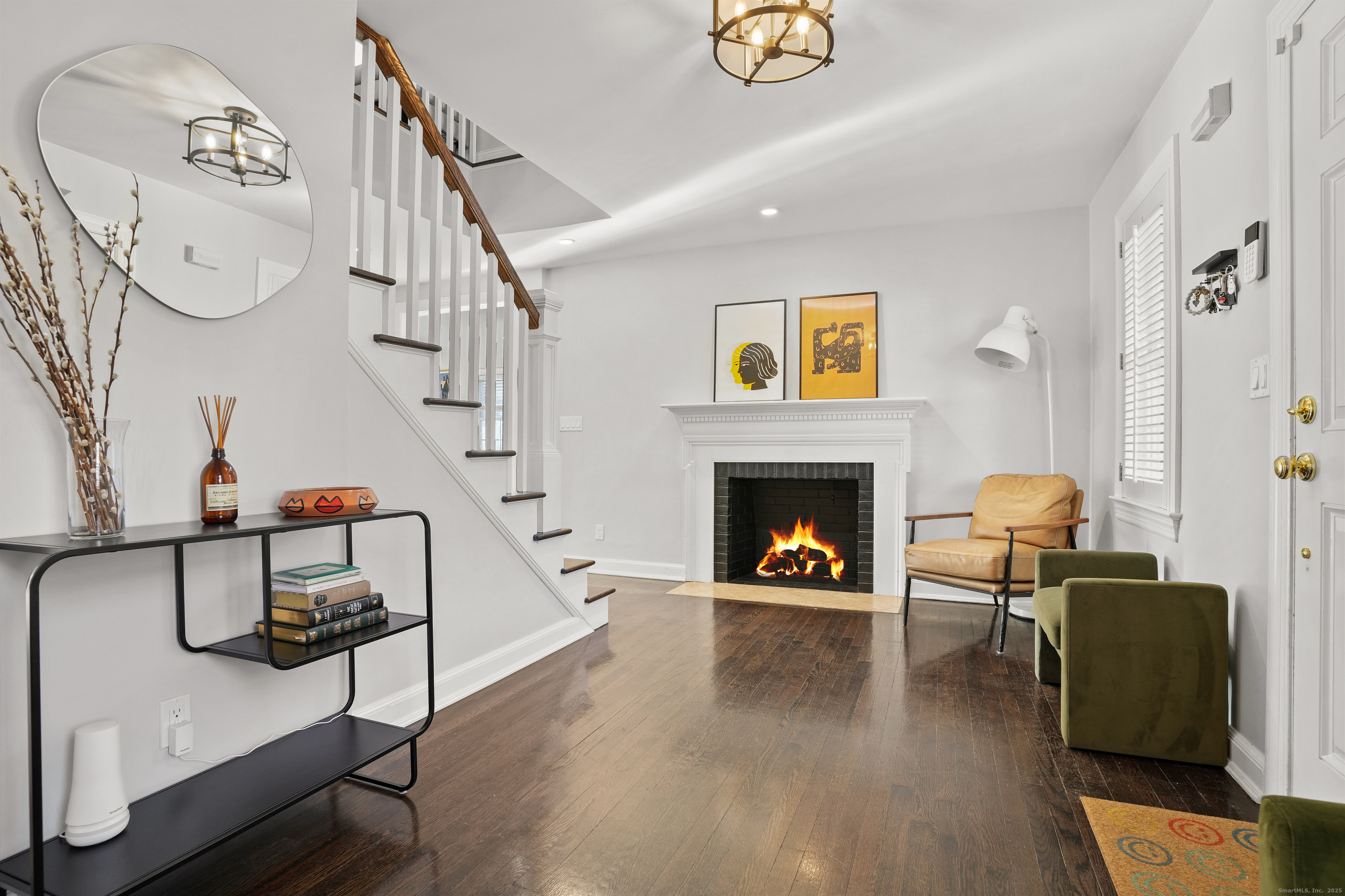 100 Hirsch Road Stamford, CT 06905 - Photo 4 of 39 a living room with furniture and a fireplace