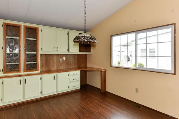 a kitchen with a stove and a refrigerator