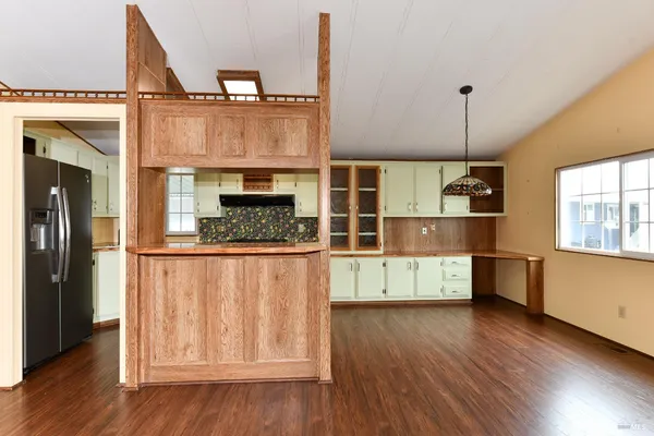a kitchen with sink and window