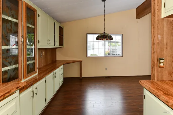 a stove top oven sitting inside of a kitchen
