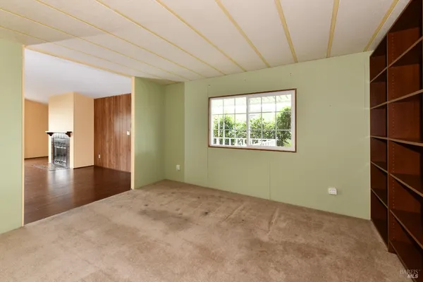 a view of an empty room and window