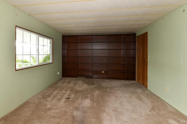 a view of an empty room with window