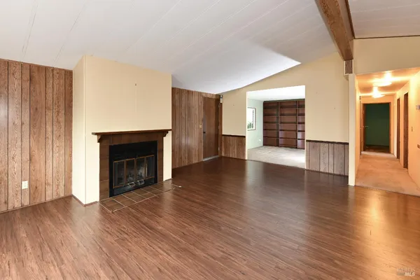 a view of a livingroom with furniture and wooden floor