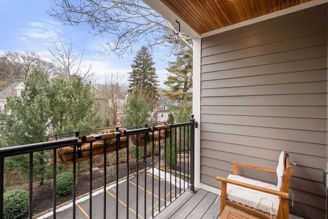 a view of a balcony with wooden floor