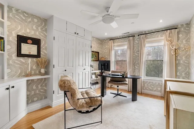 a view of a livingroom with furniture and a window