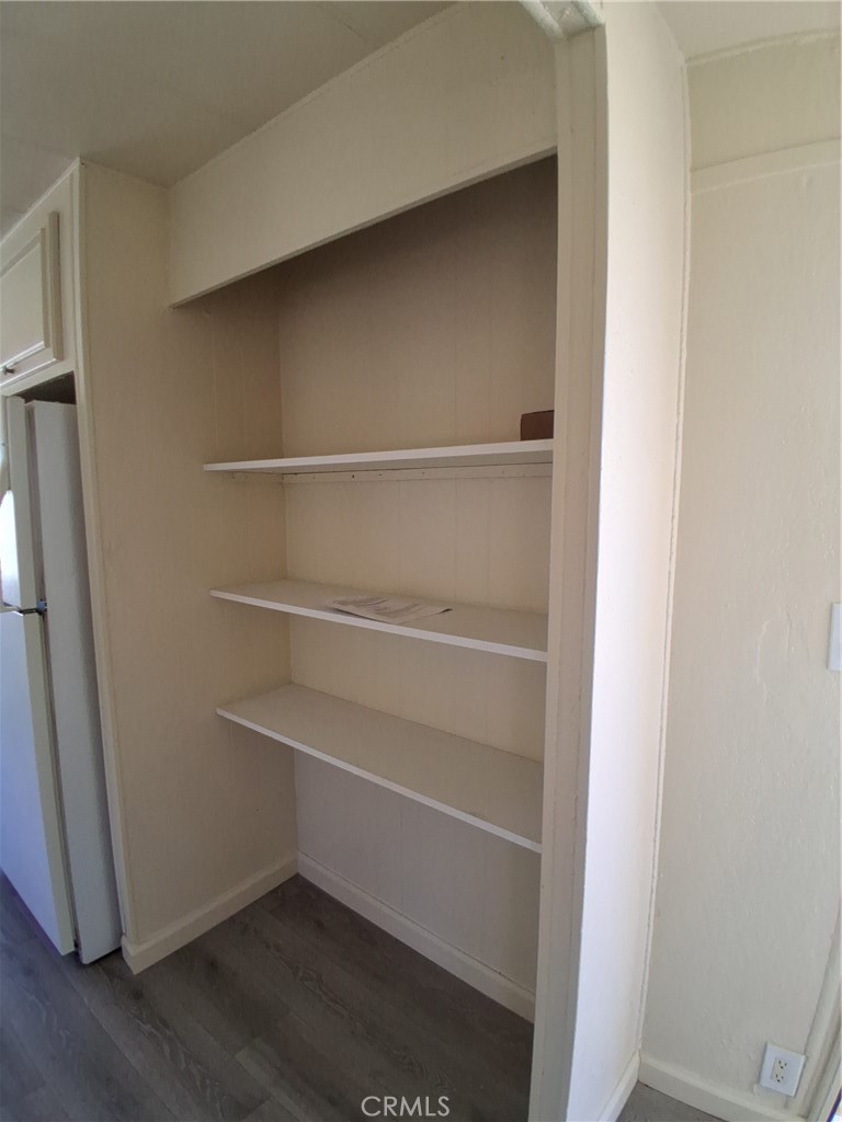 4561 Adobe Road, Unit 40 Twentynine Palms, CA 92277 - Photo 13 of 29 a view of walk in closet with empty racks